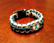 Load image into Gallery viewer, Teal Ribbon Sexual Assault Anxiety MST OCD Ovarian cancer Panic disorder PTSD Tourettes Awareness Paracord Bracelet, Keychain or Necklace